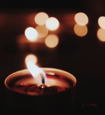 Close-Up Photo of Lighted Candle